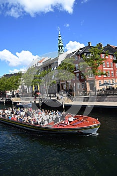 Boat tourists on canal tour copenhagen in Copenhagen Denmark