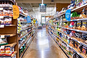 June 21, 2019 Los Altos / CA / USA - View of an aisle in a Whole Foods store, Amazon Prime Member offers visible on the shelves;