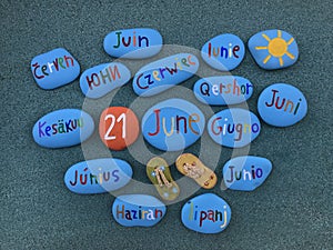 21 June in many languages on stones photo