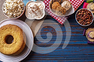 June party. Typical sweets from festa junina. Cornmeal cake, popcorn, hominy, paÃ§oca, cocada, pumpkin jam, and peanuts