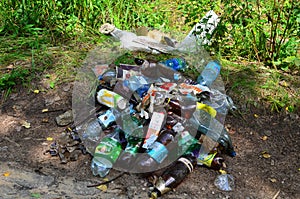 JUNE 19, 2020 Russia, Moscow: People throw away plastic bottles and food waste, leave trash on the street. Concept of