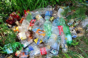 JUNE 19, 2020 Russia, Moscow: People throw away plastic bottles and food waste, leave trash on the street. Concept of