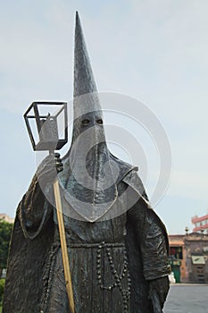 June 20, 2019 San Luis PotosÃÂ­, Mexico:Masked Man with Cross Statue Ku Klux Klan statue San Luis PotosÃÂ­ Mexico