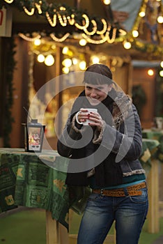 Junge Frau am GlÃ¯Â¿Â½hweinstand | young woman drinks glogg photo