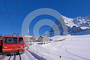 Jungfrau railway train station at Kleine Scheidegg to Jungfraujoch, north face of mount Eiger in background, Switzerland