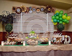 Jungle birthday table with cake photo