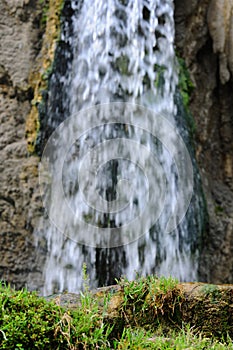 Jungle waterfall cascade in tropical rainforest with rock and turquoise blue pond. Its name Banyumala because its twin waterfall