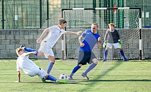 Junior football teams having scrimmage