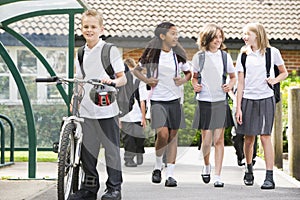 Junior school children leaving school photo