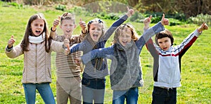 Junior school girls and boys spending time together