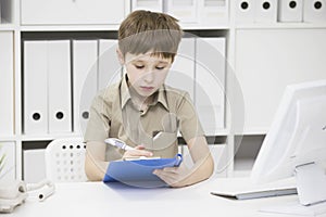 Junior school student does his homework.