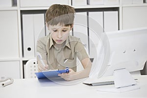 Junior school student does his homework.