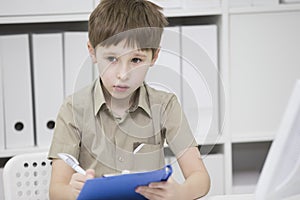 Junior school student does his homework.