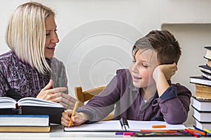 Junior student does homework with the help of his tutor. Help.