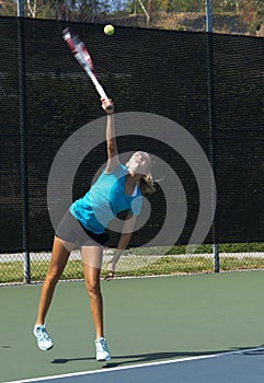 Junior Tennis Player Serving