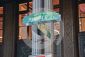 Juniper Street and South Penn Square street signs on pole in center city Philadelphia.