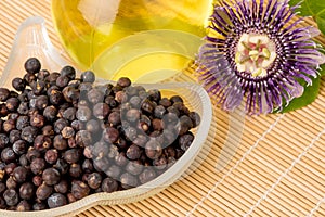 Junipers  or Juniperus ,dried fruits and oil on a white background.