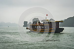 Junk Boat Floating on the water in Halong Bay, Vietnam. Tourism, activities for travelers in Asia. Vietnamese ocean