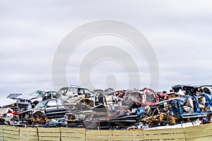 Junk Cars Stacked in Scrap Yard for recycling