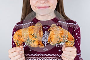 Junk food dependency concept. Cropped closeup photo of cute kid child teenager girl holding two greasy oily fatty fried portions