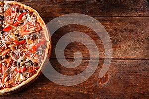 Junk food. Italian pizza cut in slices, flat lay