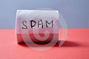 Junk mail or spam e-mail and unsolicited letter idea. Roll of toilet paper with the inscription spam