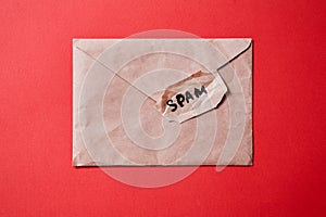 Junk mail or spam e-mail and unsolicited letter idea. The word `spam` on the envelope