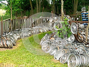 Junk yard full of automobile hub caps