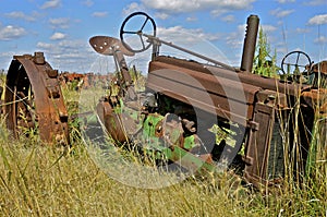 Junked tractor lacking parts and tires