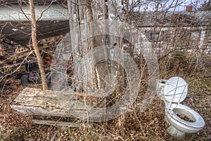 Junky yard with weeds and debris