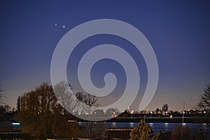 Jupiter and Saturn planets in the night sky appearing as a rare phenomenon at dusk during winter