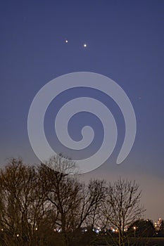 Jupiter and Saturn planets in the night sky appearing as a rare phenomenon at dusk during winter