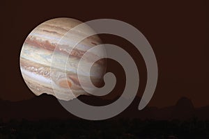 Jupiter silhouette mountain on cloud and night sky