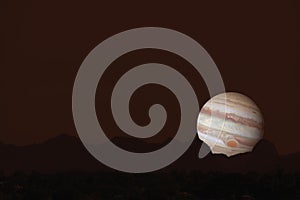 Jupiter silhouette mountain on cloud and night sky