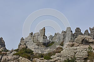 Jurassic Limestone Rock Formations in the El Torcal Nature Reserve under a blue Sky.