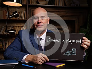 Juridical concept meaning Deduct a Payment with phrase on the page photo