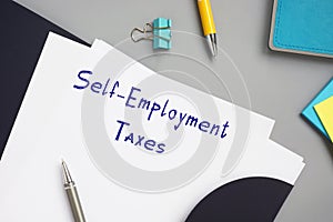 Juridical concept meaning Self-Employment Taxes with inscription on the sheet photo
