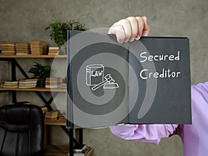 Juridical concept about Secured Creditor with sign on the sheet