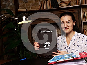 Juridical concept about Tax Evasion with inscription on the page