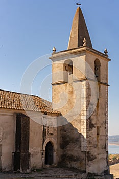 Juromenha castle tower and Guadiana river and border with Spain on the side of the river at sunrise, in Portugal