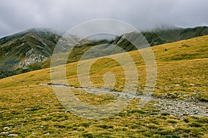 Hiking on a autumn foggy day in the High Pyrenees Mountains Catalonia, Spain photo