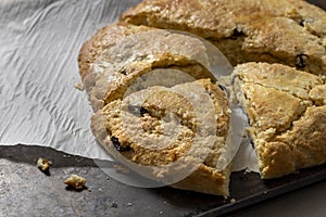 Just baked and homemade golden scone, sliced into wedges