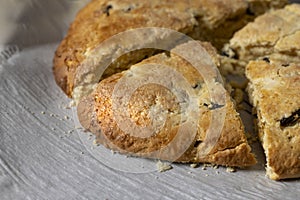 Just baked and homemade golden scone, sliced into wedges