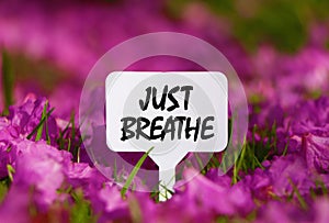 Just Breathe no sign board.