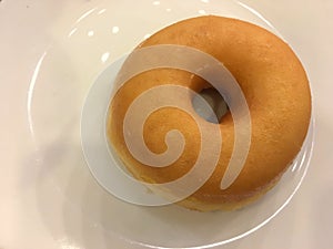 Just a donut on white plate