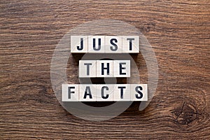 Just the facts - word written on cubes, text