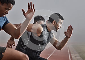 Just a little bit further. Shot of a group of male athletes participating in a race.