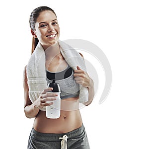 Just a little water and Im ready to go. Cropped portrait of a young female athlete with a towel around her neck against