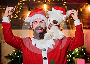 Just look at that. christmas decoration. santa claus hold teddy bear. merry christmas. man santa hat. winter holidays