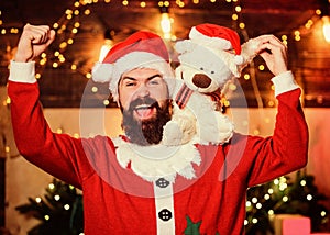 Just look at that. christmas decoration. santa claus hold teddy bear. merry christmas. man santa hat. winter holidays